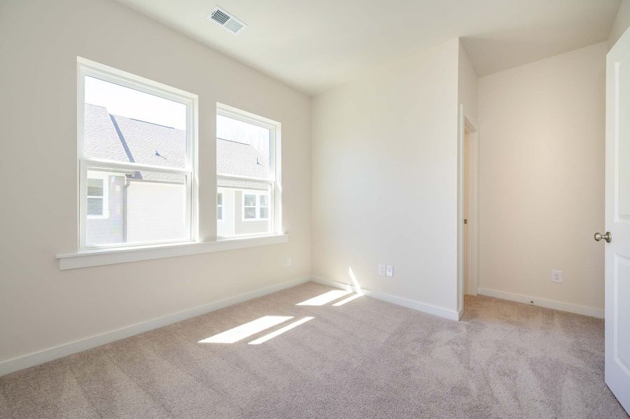 Representative unfurnished interior of a home built from the The Finney by David Weekley Homes in Central Living at Craig, Charlotte (Image 5).