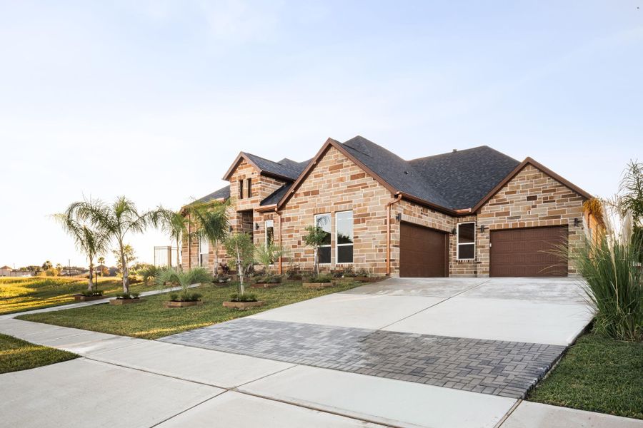 Front exterior of a new home in , Kemah, TX, highlighting curb appeal (Image 1).