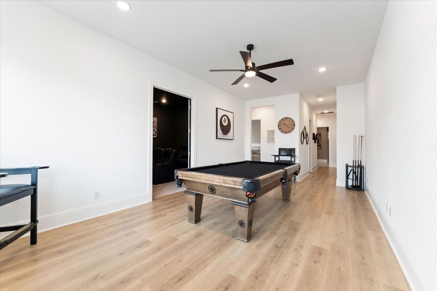 The expansive game room provides endless opportunities for entertainment and relaxation. With ample space for billiards, gaming, or gathering with family and friends, this versatile area was designed to bring everyone together.