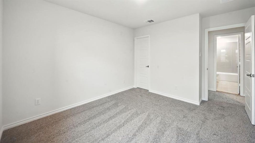 Unfurnished bedroom featuring carpet and baseboards Unfurnished bedroom featuring carpet and baseboards