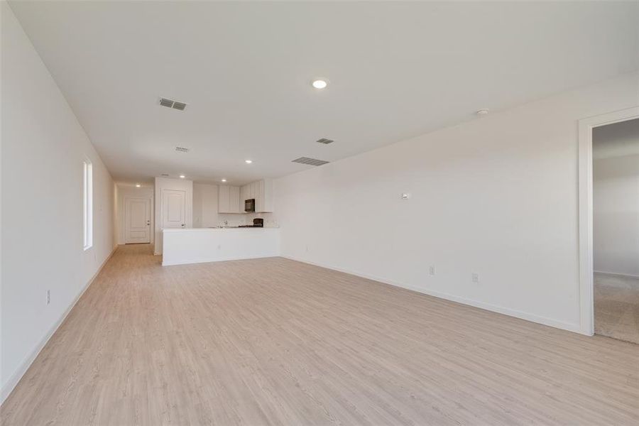 Unfurnished living room featuring light hardwood / wood-style floors