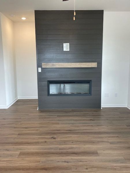 This inviting room features warm wood flooring and
