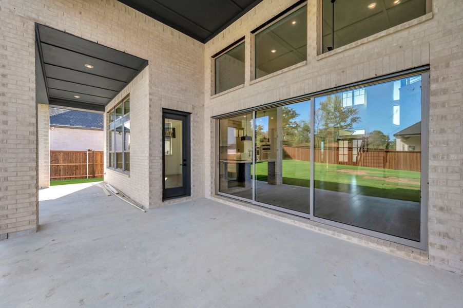 Exterior details and patio area of a home in Northshore at Lakewood Village - Estate Series, Lakewood Village (Image 3).