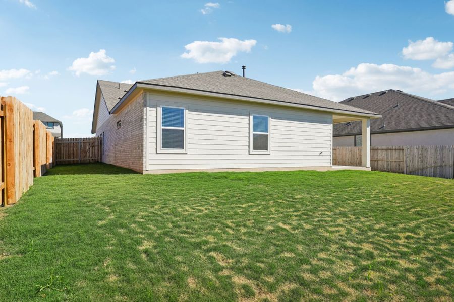 Exterior details and patio area of a home in Village at Three Oaks, Seguin (Image 19).