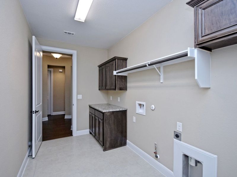 Representative furnished interior of a home built from the Madera II by Giddens Homes in Scofield Farms Estates, Georgetown (Image 247).
