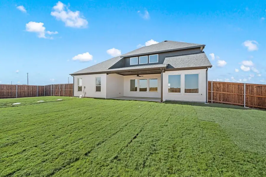 Exterior details and patio area of a home in Settlers Glen, New Fairview (Image 4).