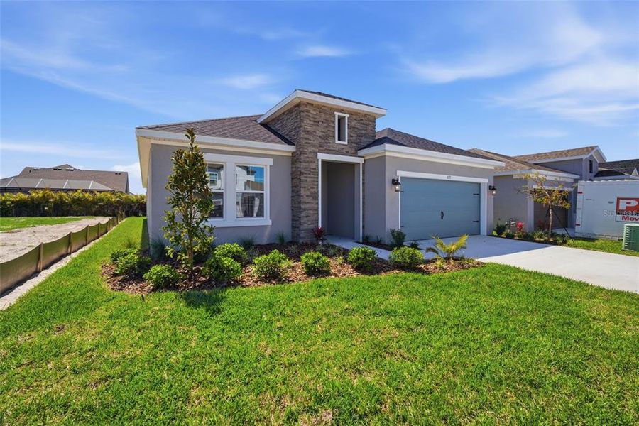 Front exterior of a new home in Waterset, Apollo Beach, FL, highlighting curb appeal (Image 2). Front exterior of a new home in Waterset, Apollo Beach, FL, highlighting curb appeal (Image 2).