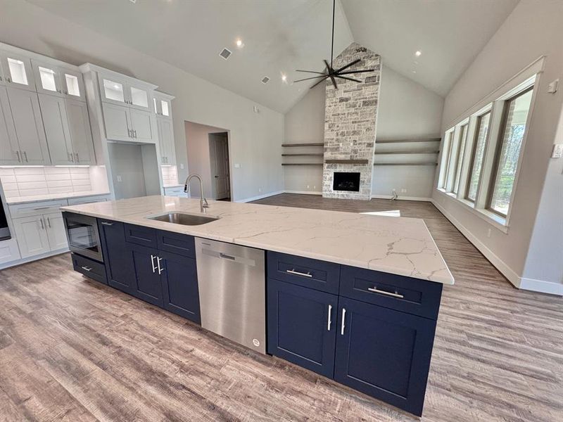 Kitchen Open to Expansive Living Area with Towering Ceilings