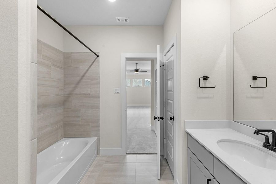 Furnished interior view inside a new home in Bridgeland, Cypress (Image 21).