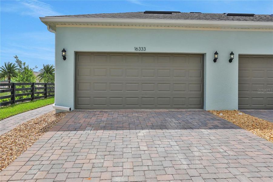Exterior details and patio area of a home in Serenade at Ovation, Winter Garden (Image 24).