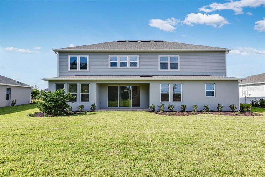 Exterior details and patio area of a home in Ardisia Park, New Smyrna Beach (Image 3).