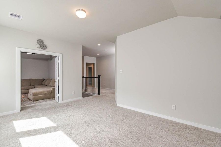 From the game room, you will see the media room with french doors.