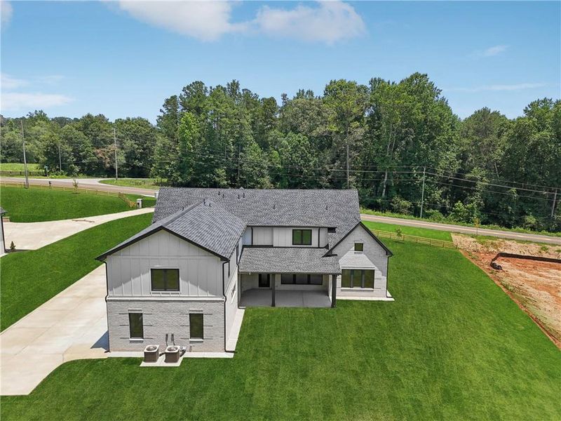 Front exterior of a new home in , Braselton, GA, highlighting curb appeal (Image 44).