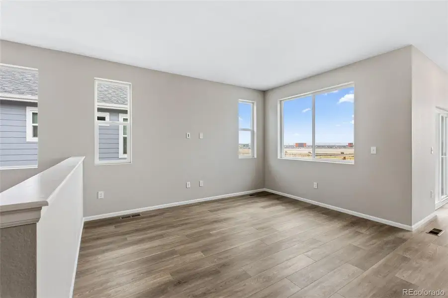 Spacious, unfurnished interior of a new home in The Cottages Collection at Ridgeline Vista, Brighton (Image 14).