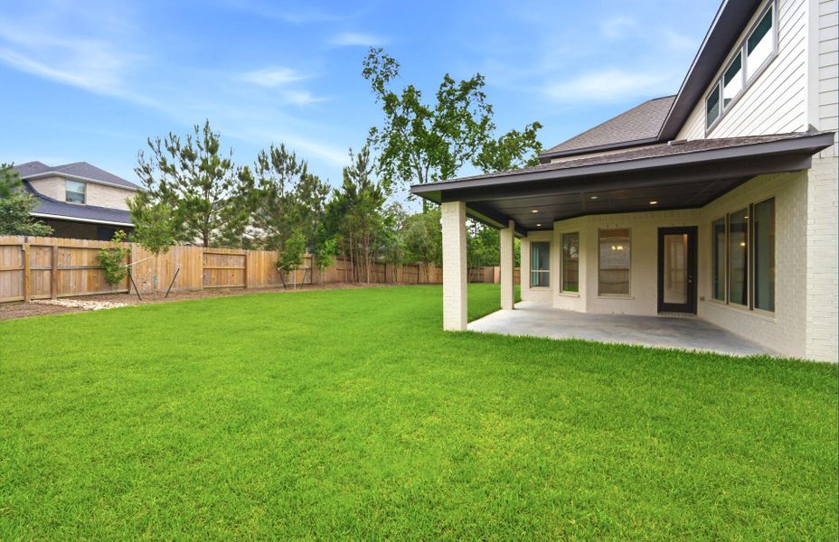 Exterior details and patio area of a home in The Woodlands Hills 65′, Willis (Image 4).