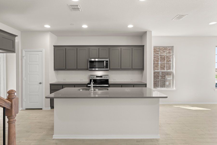 Front exterior of a new home in Sanger Circle, Sanger, TX, highlighting curb appeal (Image 10).