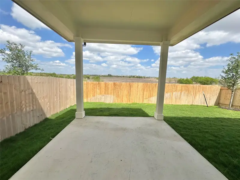 Exterior details and patio area of a home in Porter Country, Buda (Image 2).