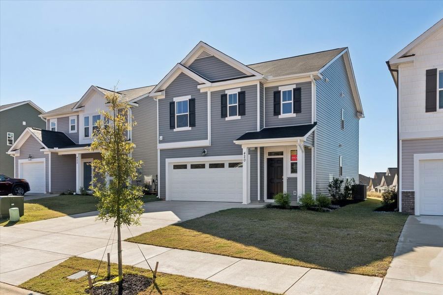 Front exterior of a new home in Windsor, North Augusta, SC, highlighting curb appeal (Image 20). Front exterior of a new home in Windsor, North Augusta, SC, highlighting curb appeal (Image 20).
