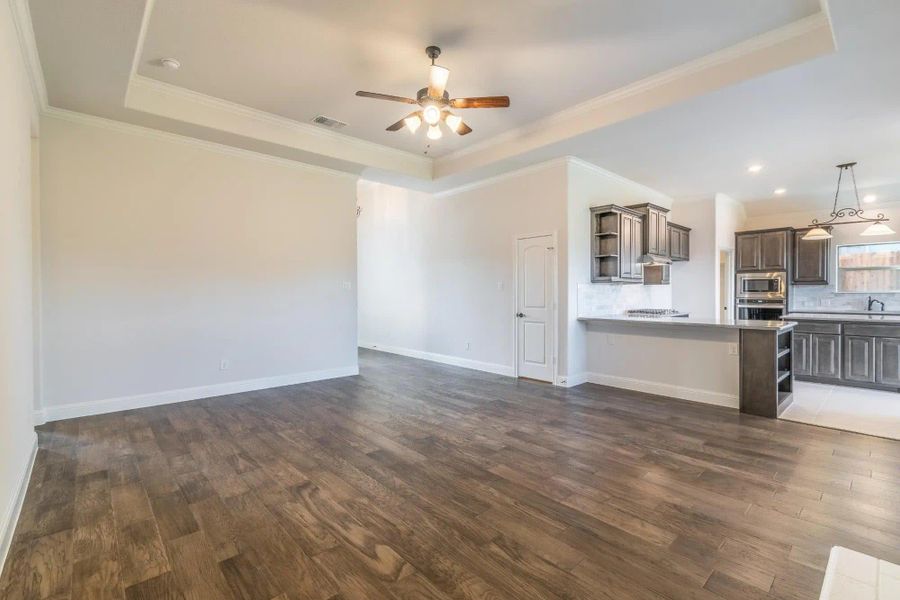 Family Room | Concept 2027 at Villages of Walnut Grove in Midlothian, TX by Landsea Homes