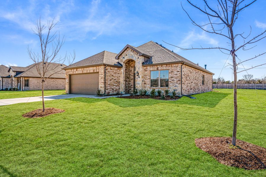 Front exterior of a new home in Mallard Point, Greenville, TX, highlighting curb appeal (Image 15). Front exterior of a new home in Mallard Point, Greenville, TX, highlighting curb appeal (Image 15).