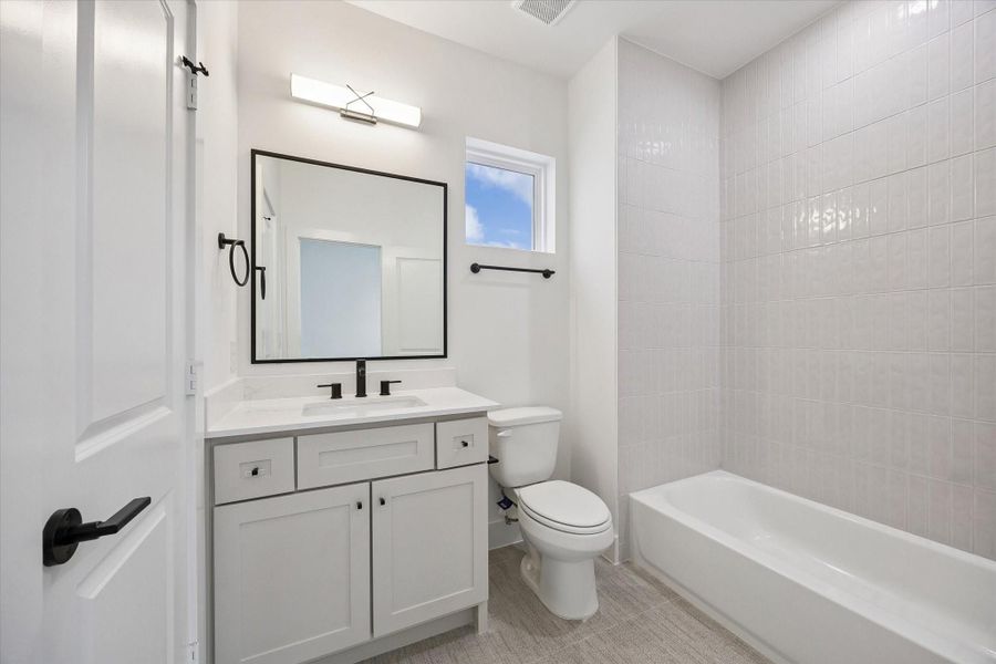 Private en-suite secondary bathroom located within the third-floor bedroom—designed for comfort and convenience.