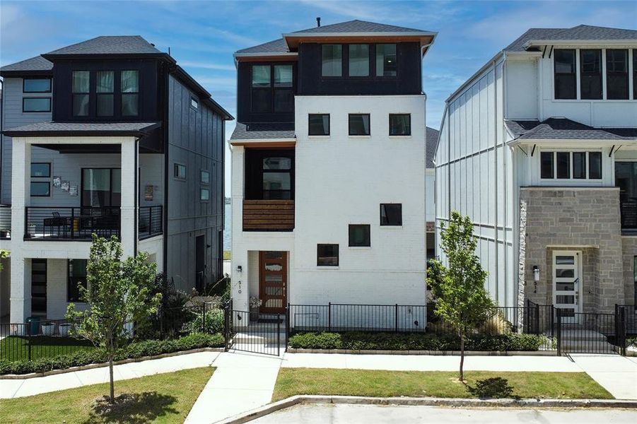 Front exterior of a new home in , Rowlett, TX, highlighting curb appeal (Image 19).