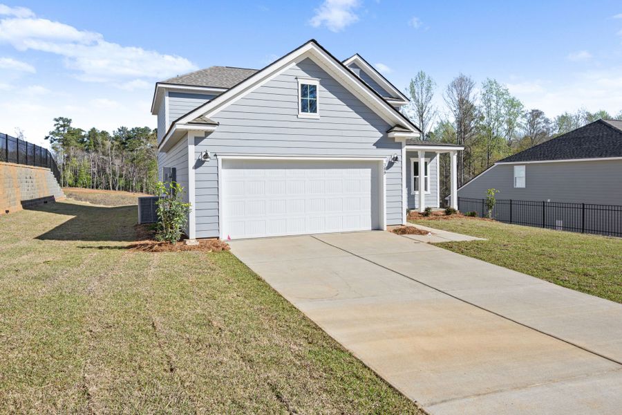 Front exterior of a new home in Carriage Estates, Lexington, SC, highlighting curb appeal (Image 26).