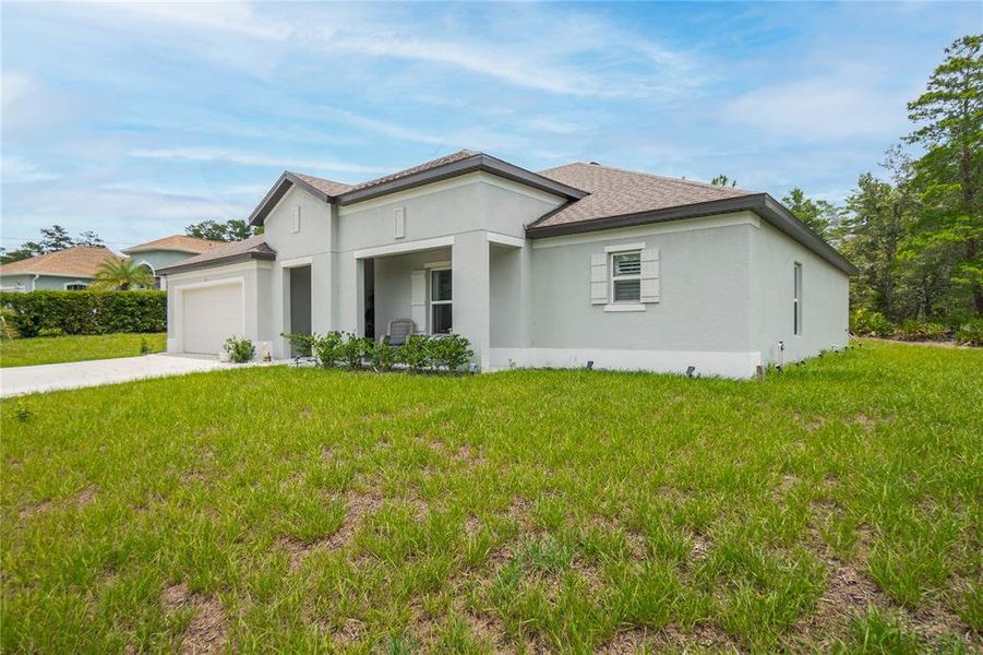 Front exterior of a new home in , Homosassa, FL, highlighting curb appeal (Image 24). Front exterior of a new home in , Homosassa, FL, highlighting curb appeal (Image 24).