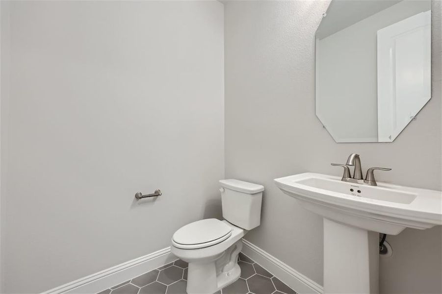 Bathroom featuring tile flooring and toilet