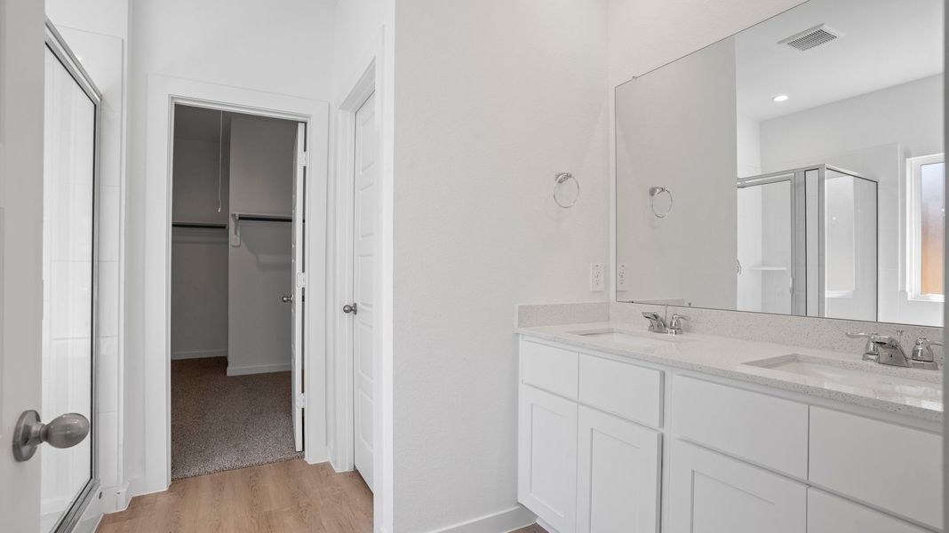 Representative furnished interior of a home built from the Mitchell by D.R. Horton in Caldwell Crossing, Iowa Colony (Image 8).