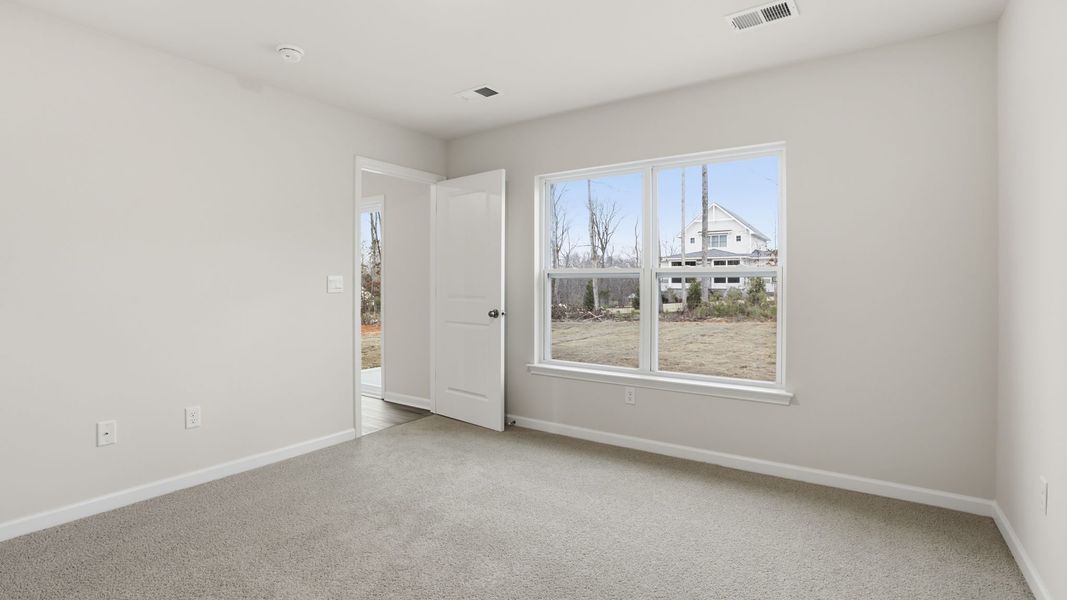 Spacious, unfurnished interior of a new home in Bentley Park, Greenwood (Image 24).