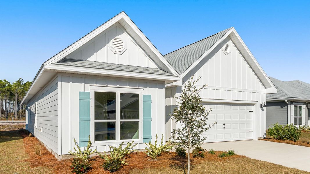 Front exterior of a new home in Bayside at Ward Creek, Panama City Beach, FL, highlighting curb appeal (Image 2).