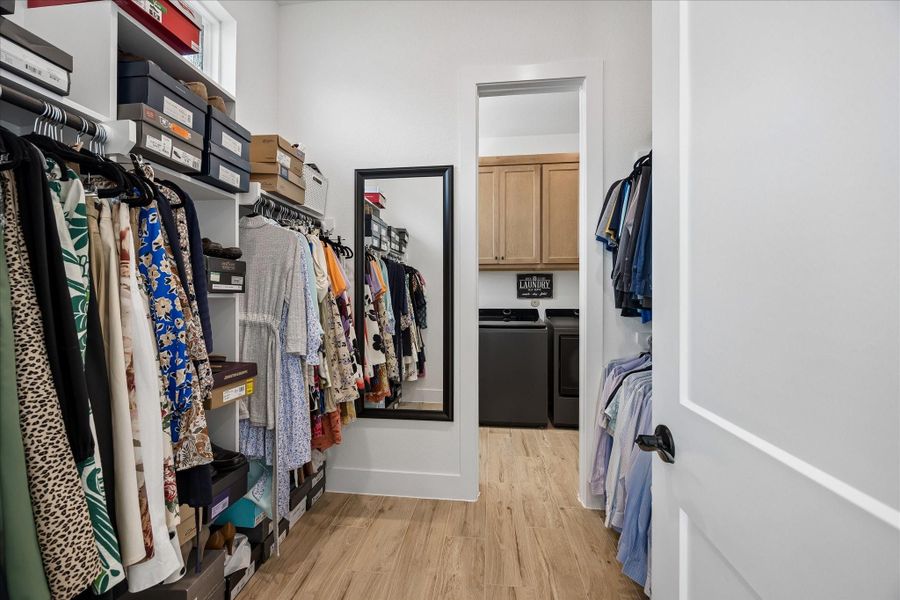 Convenient, direct access from the one of the primary closets to the spacious laundry room.