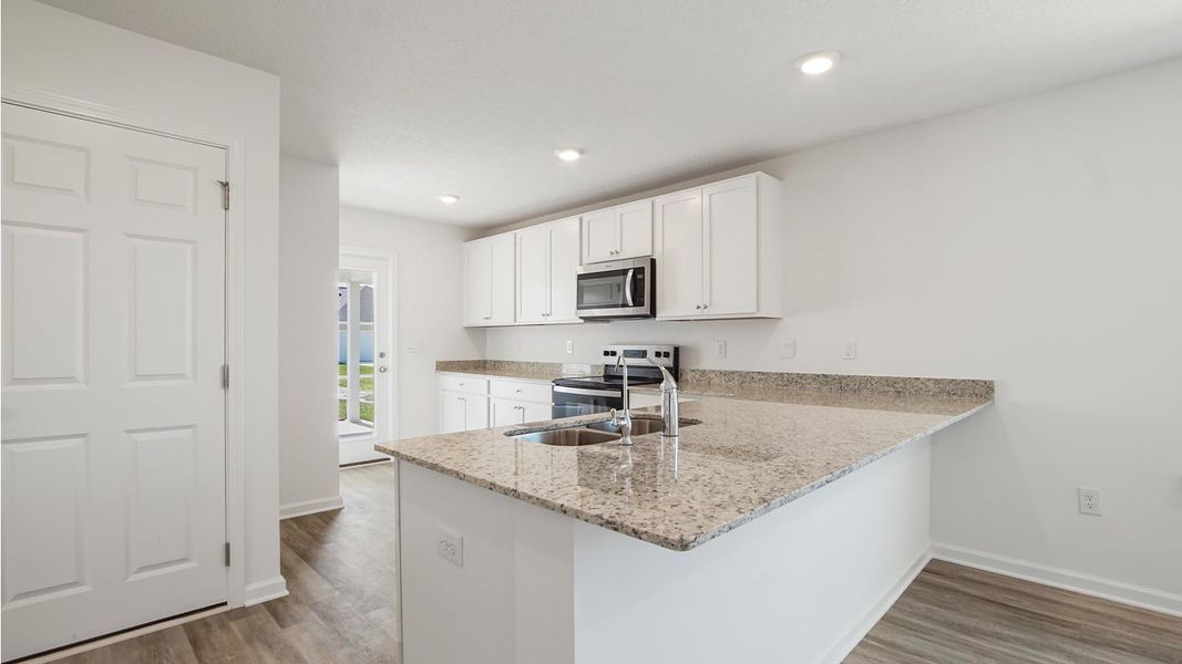 Representative furnished interior of a home built from the Inzer by D.R. Horton in Owl's Head East, Freeport (Image 5). Representative furnished interior of a home built from the Inzer by D.R. Horton in Owl's Head East, Freeport (Image 5).