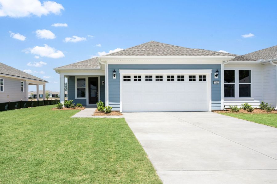 Front exterior of a new home in Sun City Hilton Head, Bluffton, SC, highlighting curb appeal (Image 2). Front exterior of a new home in Sun City Hilton Head, Bluffton, SC, highlighting curb appeal (Image 2).