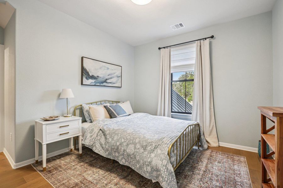 The second level hosts two additional secondary bedrooms, each with private en-suite baths.