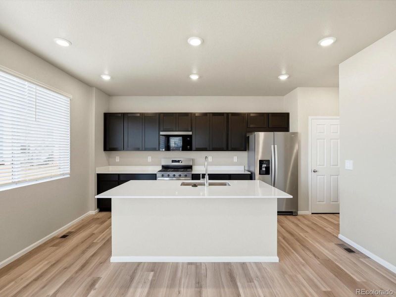 Furnished interior view inside a new home in Buffalo Highlands: The Flora Collection, Commerce City (Image 13).
