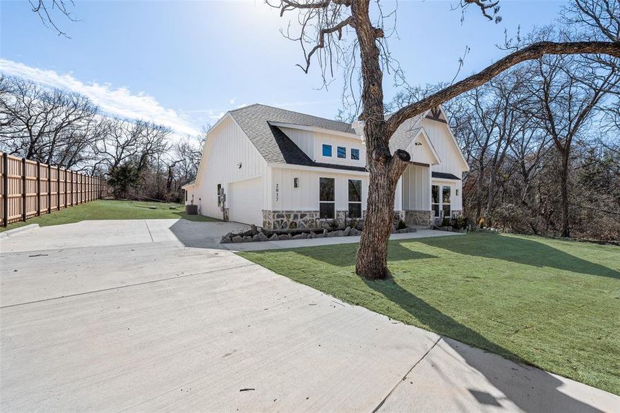 Front exterior of a new home in , Azle, TX, highlighting curb appeal (Image 2). Front exterior of a new home in , Azle, TX, highlighting curb appeal (Image 2).