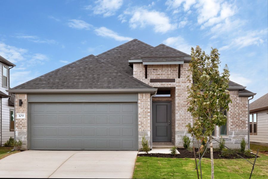 Front exterior of a new home in Prairie Winds, Hutto, TX, highlighting curb appeal (Image 2). Front exterior of a new home in Prairie Winds, Hutto, TX, highlighting curb appeal (Image 2).