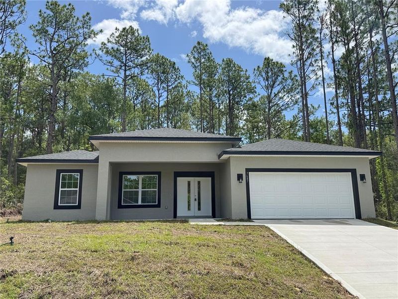 Front exterior of a new home in , Dunnellon, FL, highlighting curb appeal (Image 2).
