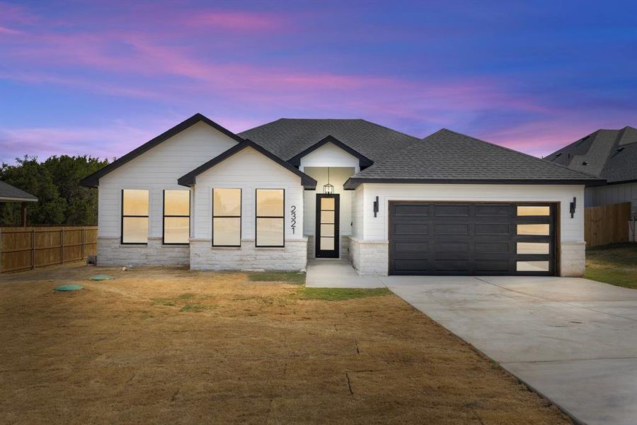 Front exterior of a new home in , Granbury, TX, highlighting curb appeal (Image 22). Front exterior of a new home in , Granbury, TX, highlighting curb appeal (Image 22).
