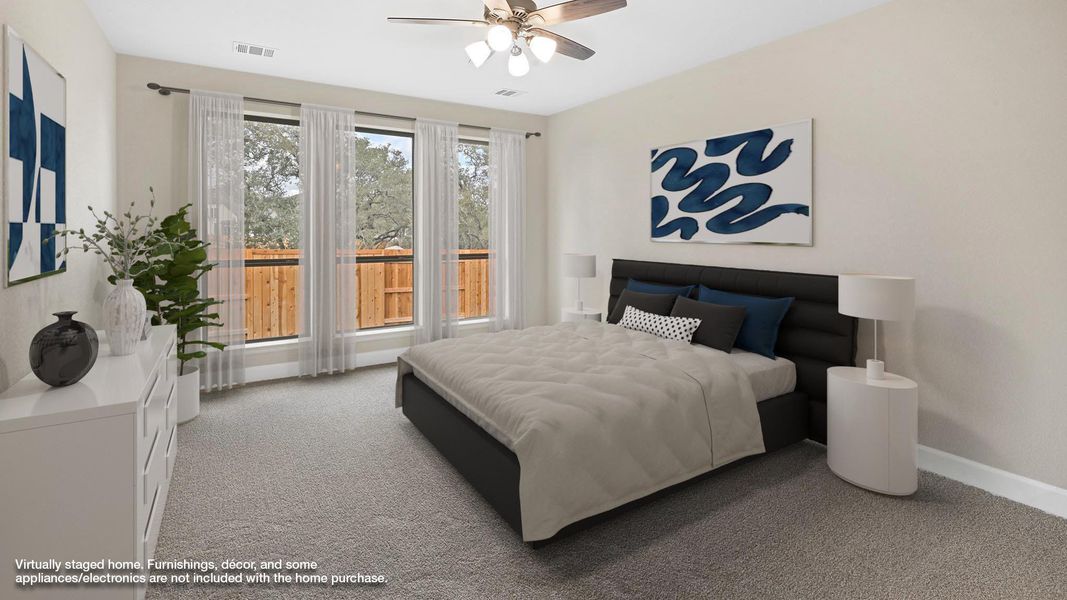 Bedroom featuring light carpet and a ceiling fan