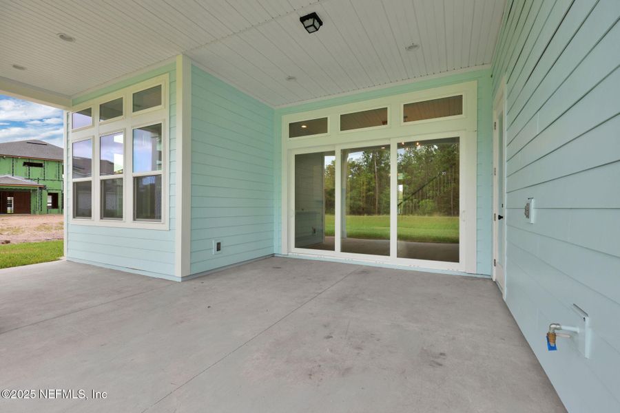 Exterior details and patio area of a home in Courtney Oaks at SilverLeaf, St. Augustine (Image 3).