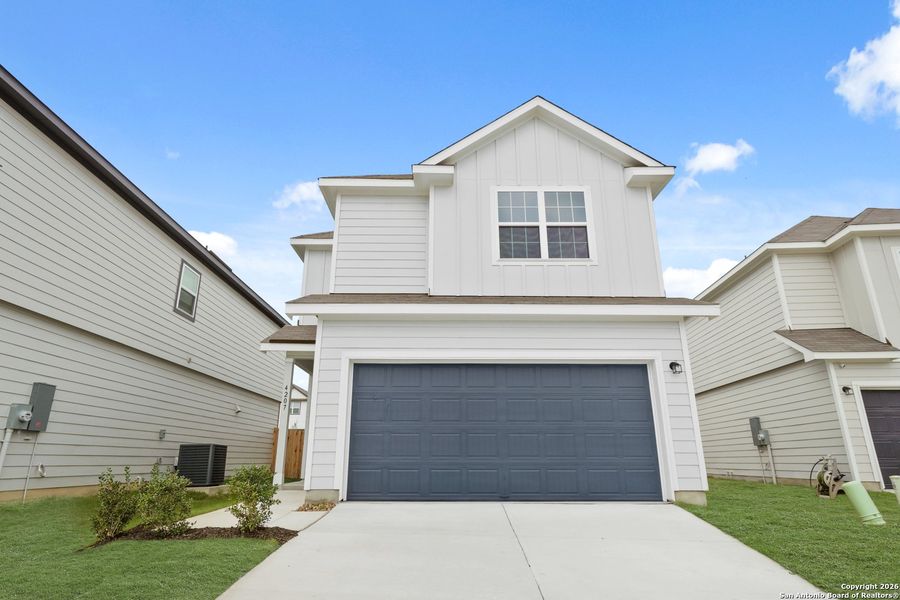 Front exterior of a new home in Melissa Ranch, San Antonio, TX, highlighting curb appeal (Image 17).