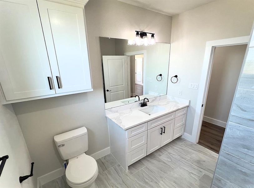 Bathroom with vanity and tiled floors