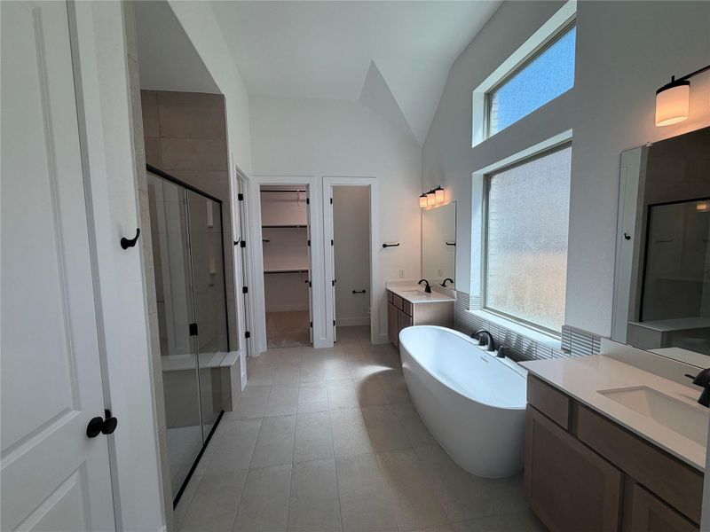 Primary Bath retreat with dual vanities, soaking tub & walk-in shower
