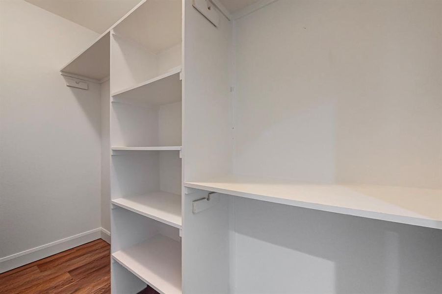 Walk in closet featuring wood-type flooring