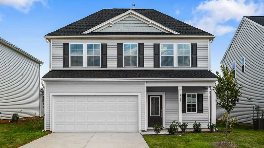 Front exterior of a new home in Hanes Lake, Winston-Salem, NC, highlighting curb appeal (Image 1). Front exterior of a new home in Hanes Lake, Winston-Salem, NC, highlighting curb appeal (Image 1).