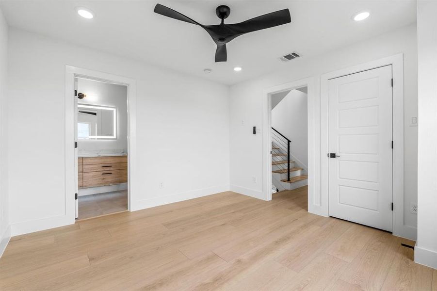 Unfurnished bedroom with baseboards, recessed lighting, visible vents, and light wood-type flooring