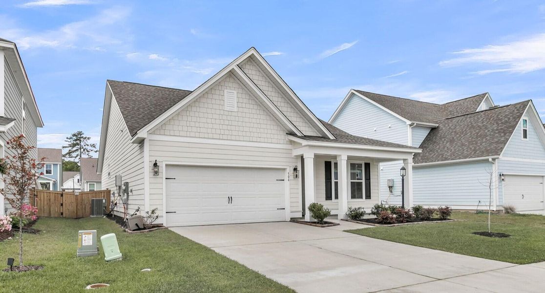 Front exterior of a new home in High Point at Foxbank, Moncks Corner, SC, highlighting curb appeal (Image 27).